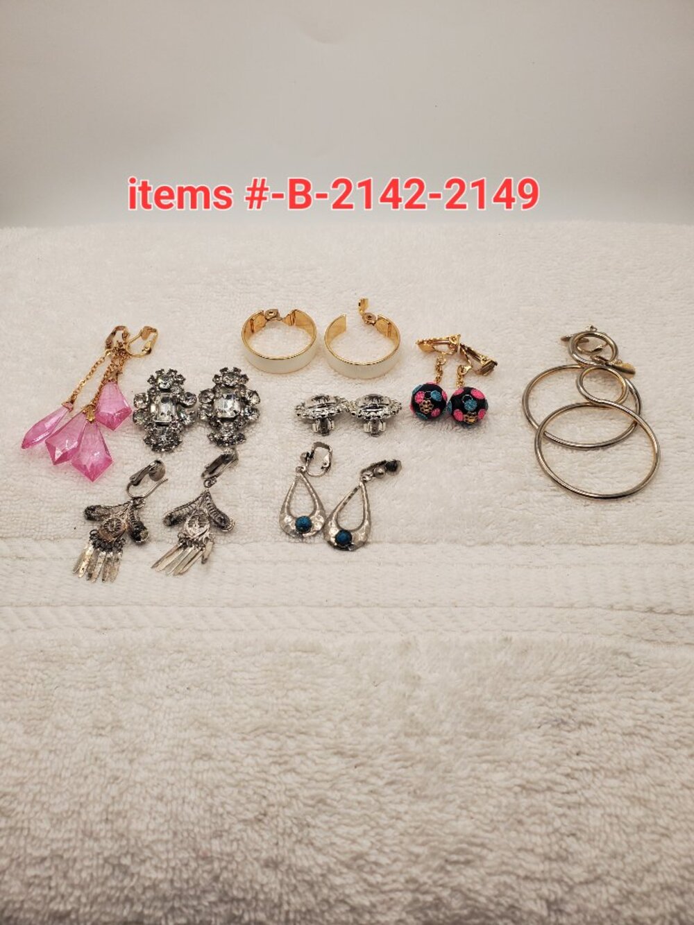 8 Pair of clip on Earrings, items # B-2142-2149, wt. 82 grams.